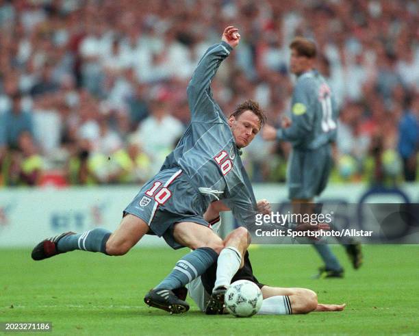 June 26: Teddy Sheringham of England and Dieter Eilts of Germany challenge during the UEFA Euro 1996 Semi Final match between Germany and England at...