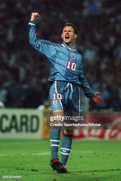 June 26: Teddy Sheringham of England celebrates scoring his penalty during the UEFA Euro 1996 Semi Final match between Germany and England at Wembley...