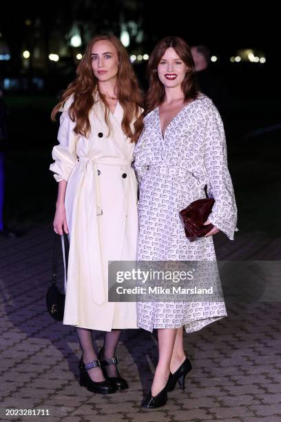 Elizabeth Jagger and Georgia May Jagger attend the Burberry show during London Fashion Week February 2024 at Victoria Park on February 19, 2024 in...