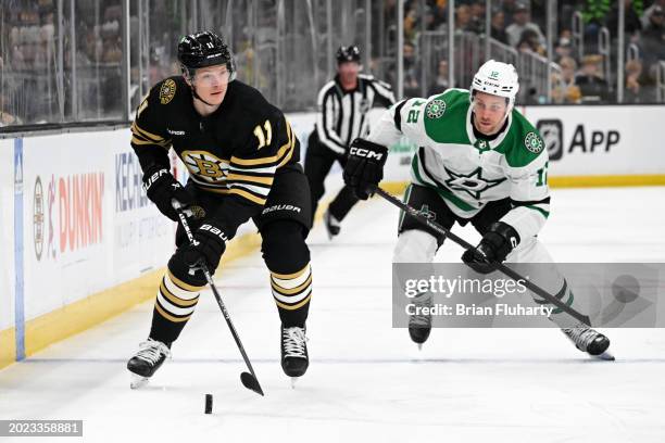 Trent Frederic of the Boston Bruins skates against Radek Faksa of the Dallas Stars during the first period at the TD Garden on February 19, 2024 in...