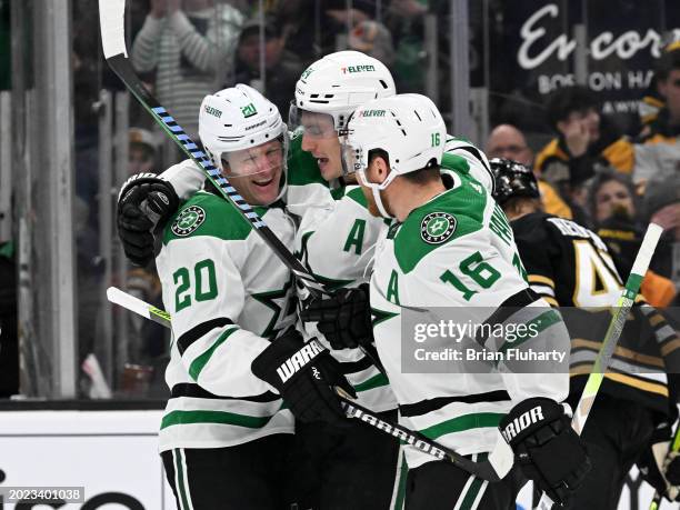 Ryan Suter of the Dallas Stars celebrates with Roope Hintz and Joe Pavelski after scoring a goal against the Boston Bruins during the second period...