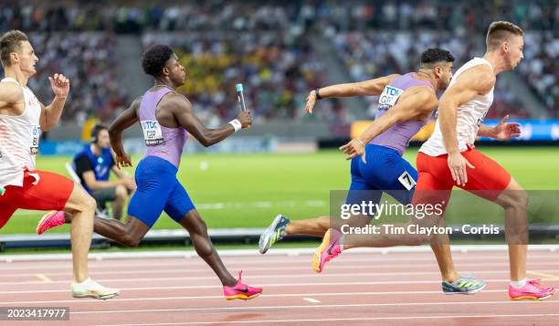 August 25: Adam Gemili of Great Britain receives the baton from Jeremiah Azu of Great Britain at the first changeover during the Men's 4x100 Metres...
