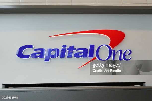 Sign above an ATM at a Capital One Café on February 19 in Miami, Florida. Capital One announced plans to buy Discover Financial Services in a deal...
