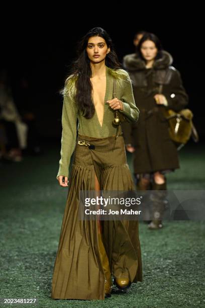 Neelam Gill walks the runway at the Burberry show during London Fashion Week February 2024 at on February 19, 2024 in London, England.