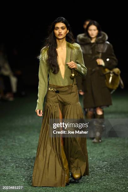 Neelam Gill walks the runway at the Burberry show during London Fashion Week February 2024 at on February 19, 2024 in London, England.