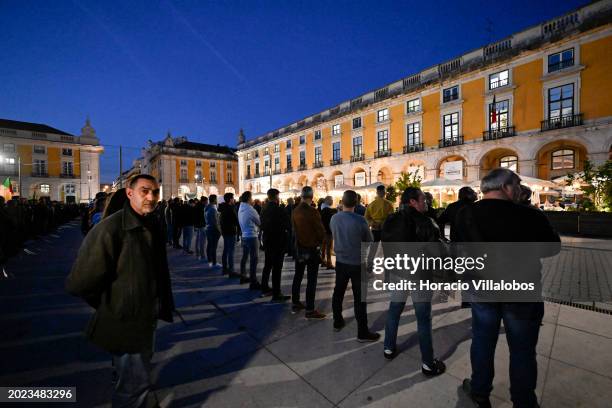 Demonstrators stand in formation during a protest staged in front of the Ministry of Internal Affairs , at Praça do Comercio, by members of the...