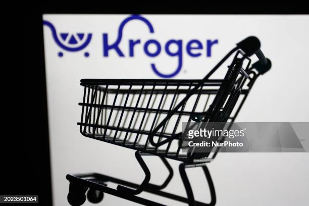 Kroger logo displayed on a laptop screen and a small shopping cart are seen in this illustration photo taken in Krakow, Poland on February 22, 2024.