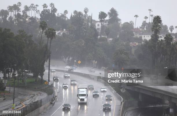 Vehicles drive through the rain on the 101 freeway on February 19, 2024 in Los Angeles, California. Another atmospheric river storm is delivering...