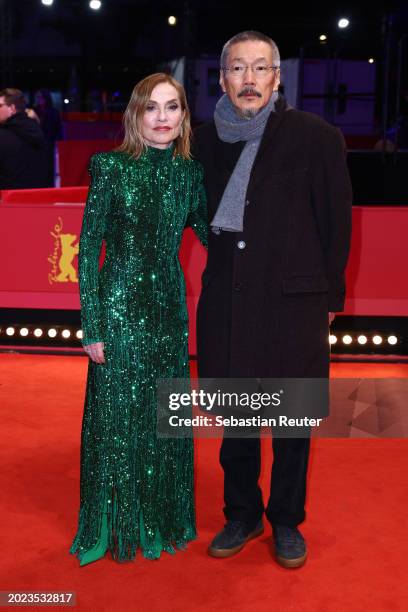 Isabelle Huppert and Hong Sang-soo attend the "Yeohaengjaui pilyo" premiere during the 74th Berlinale International Film Festival Berlin at Berlinale...