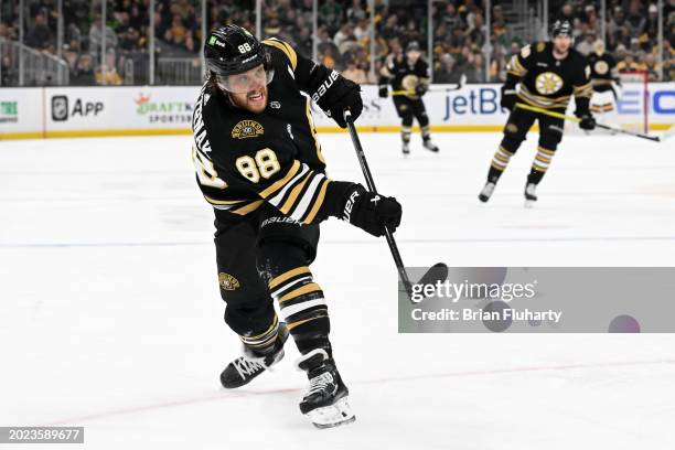 David Pastrnak of the Boston Bruins takes a shot against the Dallas Stars during the third period at the TD Garden on February 19, 2024 in Boston,...