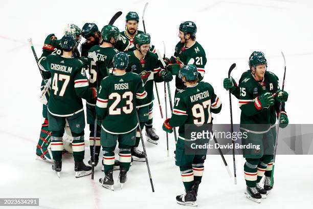 Members of the Minnesota Wild celebrate their victory against the Vancouver Canucks after the game at Xcel Energy Center on February 19, 2024 in St...