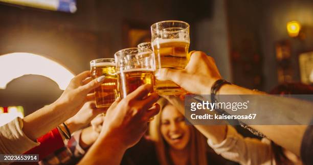 happy friends group drinking beer at brewery bar restaurant - friendship concept with young people enjoying time together and having genuine fun at cool vintage pub - oktoberfest 2018 stock pictures, royalty-free photos & images
