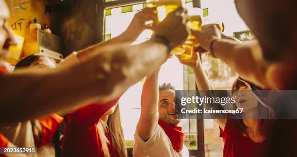 happy friends group drinking beer at brewery bar restaurant - friendship concept with young people enjoying time together and having genuine fun at cool vintage pub - england v germany stock pictures, royalty-free photos & images