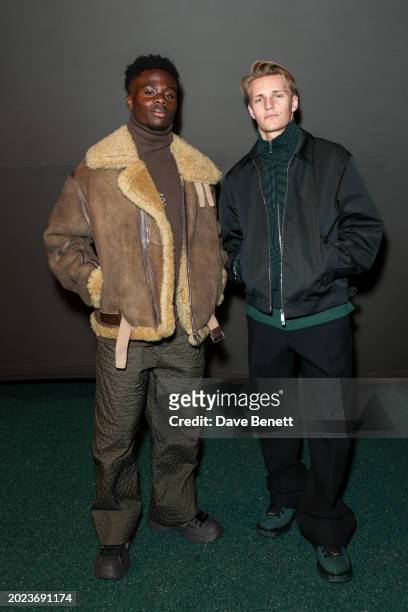 Bukayo Saka and Martin Ødegaard attend the Burberry Winter 2024 show during London Fashion Week on February 19, 2024 in London, England.