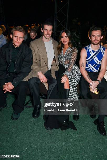 Martin Ødegaard, Gareth Bale, Emma Rhys-Jones and Ben Chilwell attend the Burberry Winter 2024 show during London Fashion Week on February 19, 2024...