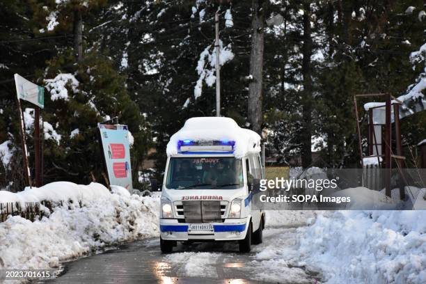 An ambulance carrying the body of a Russian skier arrives at a hospital in Tangmarg, near Gulmarg, a popular skiing destination in Kashmir. One skier...
