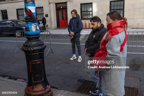 People leave flowers and candles in memory of Russian dissident Alexei Navalny outside the Russian Consulate, February 19 in New York City. The...