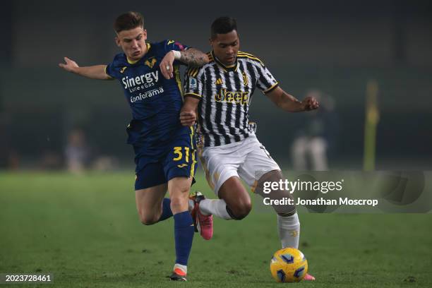 Tomas Suslov of Hellas Verona tussles with Alex Sandro of Juventus during the Serie A TIM match between Hellas Verona FC and Juventus - Serie A TIM...