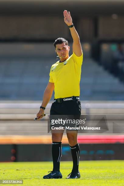 Referee Guillermo Pacheco gestures during the 6th round match between Pumas UNAM and Puebla as part of the Torneo Clausura 2024 Liga MX at Estadio...
