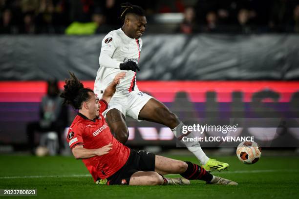 Rennes' Belgian defender Arthur Theate tackles AC Milan's Portuguese forward Rafael Leao during the UEFA Europa League round of 16 play-off match...