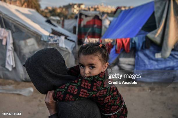 Palestinian families, who have been repeatedly displaced due to Israel's attacks on the Gaza Strip, live in the makeshift tents in an empty area in...