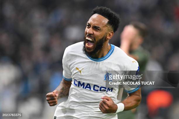Marseille's French-Gabonese forward Pierre-Emerick Aubameyang celebrates scoring his team's first goal during the UEFA Europa League knockout round...