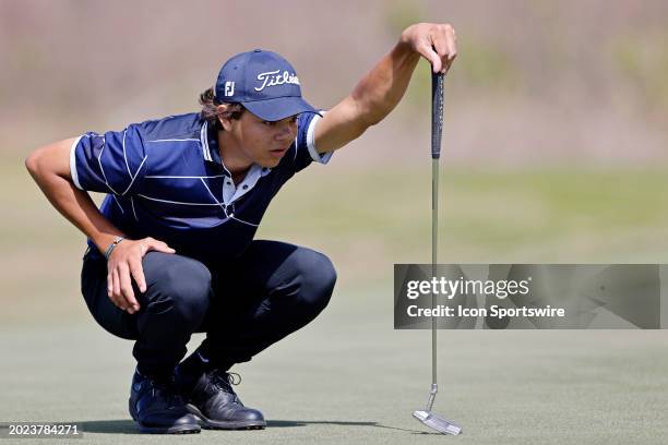 Charlie Woods, son of Tiger Woods, lines up a putt during pre-qualifying for The Cognizant Classic in The Palm Beaches at Lost Lake Golf Club on...