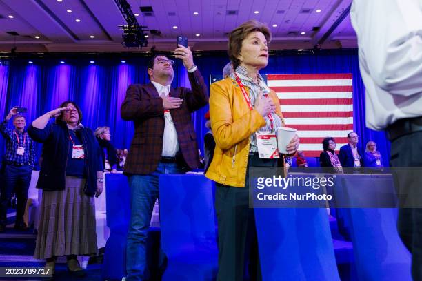 People are standing during the national anthem at the opening of the second day of the Conservative Political Action Conference at the Gaylord Hotel...