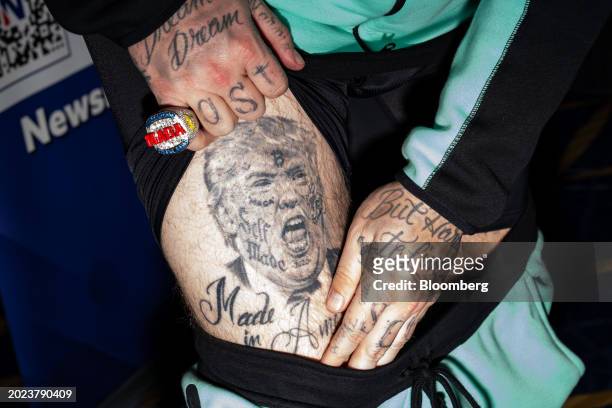 An attendee shows their tattoo during the Conservative Political Action Conference in National Harbor, Maryland, US, on Thursday, Feb. 22, 2024. The...