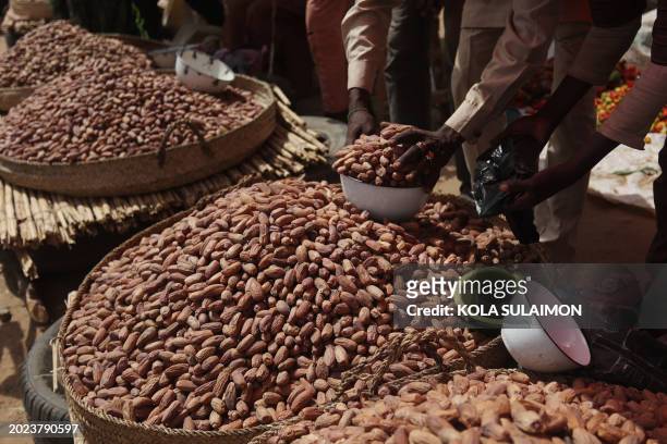 Tiger nuts are sold at the market in Jibia on February 18, 2024. Nigeria, which shares 1,600 km of border with its neighbor, was until now one of...
