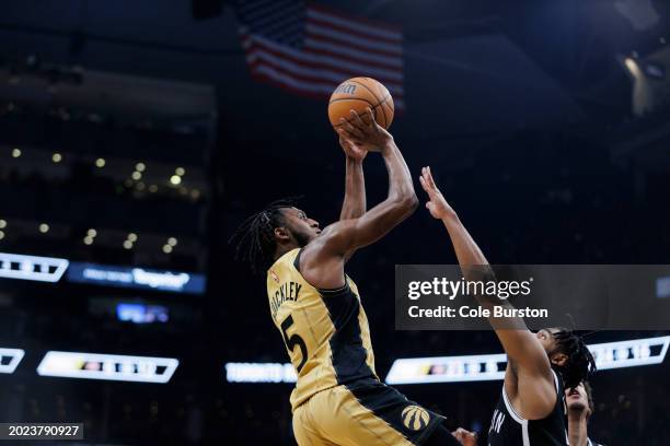 Immanuel Quickley of the Toronto Raptors puts up a shot over Cam Thomas of the Brooklyn Nets in the first half of their NBA game at Scotiabank Arena...