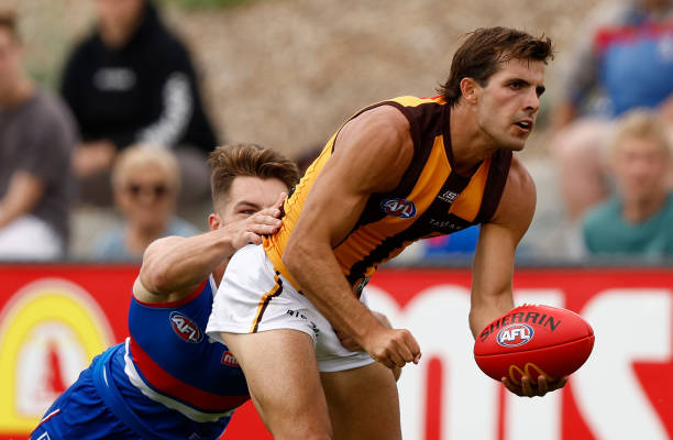 Finn Maginness of the Hawks is tackled by Rhylee West of the Bulldogs during the AFL 2024 Match Simulation between the Western Bulldogs and Hawthorn...