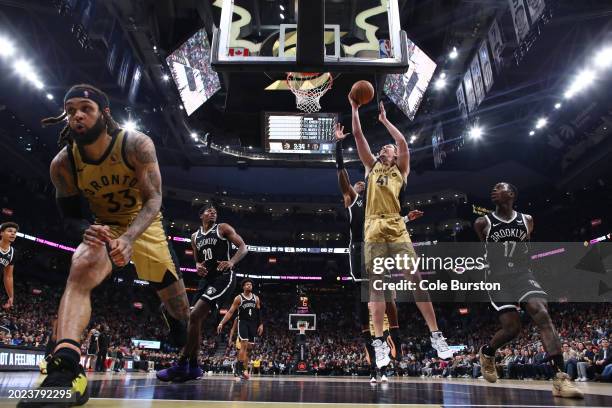 Kelly Olynyk of the Toronto Raptors goes up to the basket with a shot against the Brooklyn Nets in the second half of their NBA game at Scotiabank...