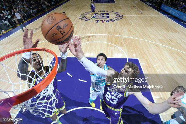 John Collins and Lauri Markkanen of the Utah Jazz attempt to rebound the ball during the game against the Charlotte Hornets on February 22, 2024 at...