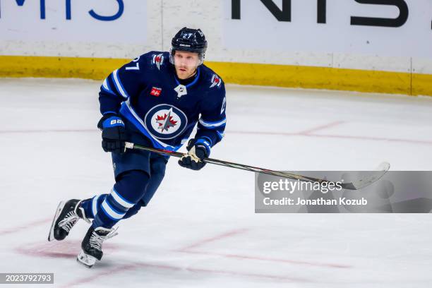 Nikolaj Ehlers of the Winnipeg Jets skates during first period action against the Minnesota Wild at Canada Life Centre on February 20, 2024 in...