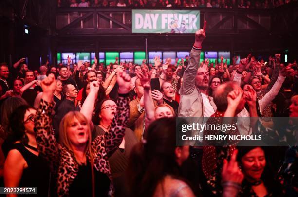 People dance during the "Day Fever" event at the club HERE at Outernet in London, February 10 2024. A crowd eagerly waits for the doors of a London...