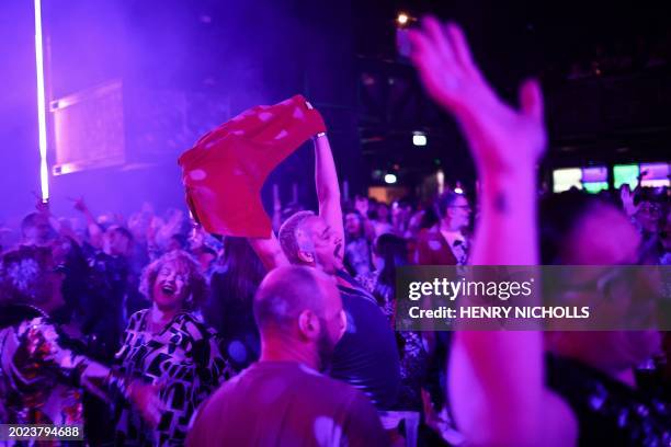 People dance during the "Day Fever" event at the club HERE at Outernet in London, February 10 2024. A crowd eagerly waits for the doors of a London...