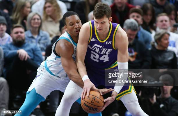 Grant Williams of the Charlotte Hornets knocks the ball away from Walker Kessler of the Utah Jazz during the second half of their game at the Delta...
