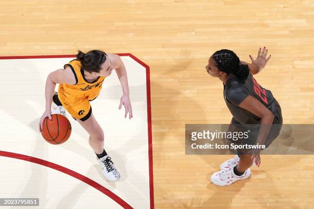 Iowa Hawkeyes guard Caitlin Clark is guarded by Indiana Hoosiers guard Chloe Moore McNeil on February 22, 2024 at Simon Skjodt in Bloomington, Indiana