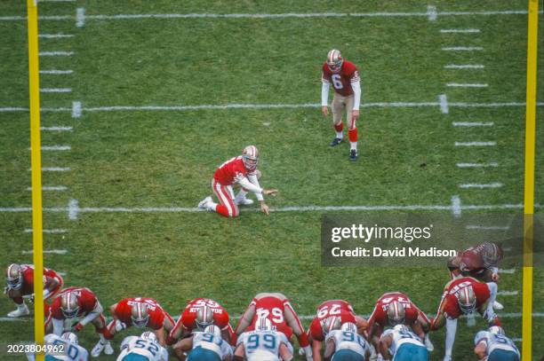 Mike Cofer of the San Francisco 49ers awaits a kick attempt as Steve Bono holds during a National Football League game against the Miami Dolphins at...