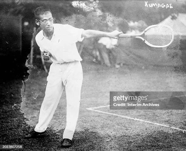 Japanese tennis player Ichiya Kumagae playing tennis, United States, 1916.