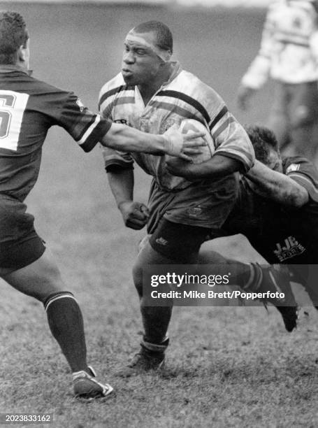 Victor Ubogu of Bath is tackled by Steve Bibby and Alun Peacock of Orrell during a Courage League National Division One match at Edge Hall Road on...