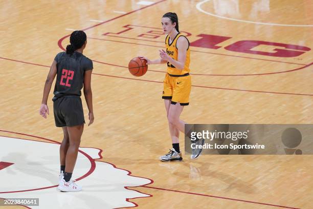 Iowa Hawkeyes guard Caitlin Clark is guarded by Indiana Hoosiers guard Chloe Moore-McNeil on February 22, 2024 at Simon Skjodt in Bloomington, Indiana