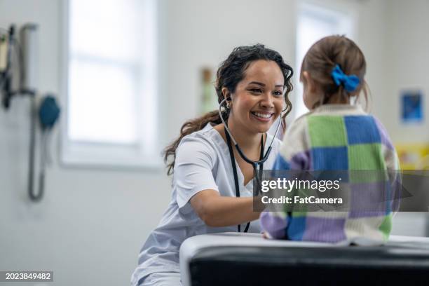 paediatrician with a young patient - primary health care stock pictures, royalty-free photos & images