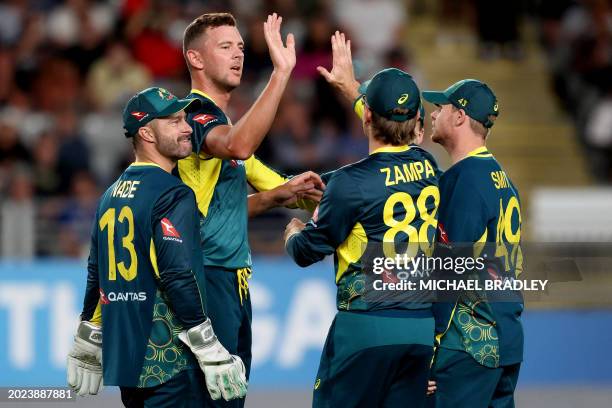 Australia's paceman Josh Hazlewood celebrates the wicket of New Zealand's Finn Allen with teammates during the second Twenty20 international cricket...