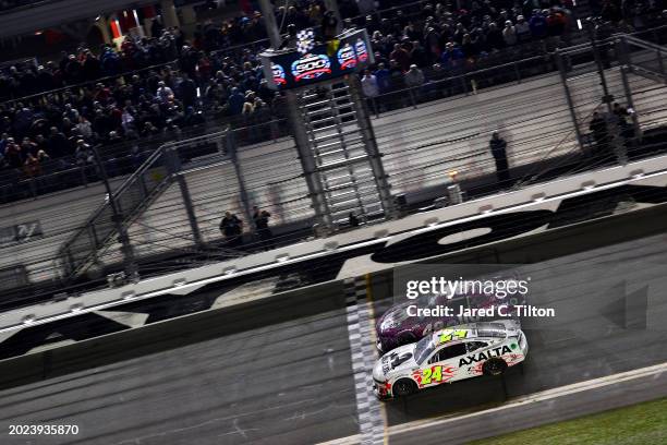 William Byron, driver of the Axalta Chevrolet, leads Alex Bowman, driver of the Ally Chevrolet, to the checkered flag to win the NASCAR Cup Series...