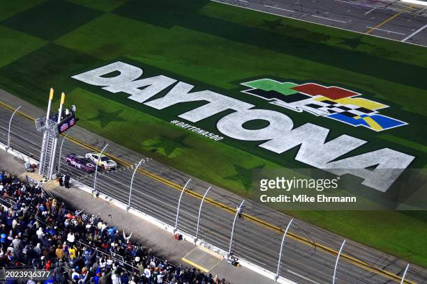 William Byron, driver of the Axalta Chevrolet, leads Alex Bowman, driver of the Ally Chevrolet, to the checkered flag to win the NASCAR Cup Series...