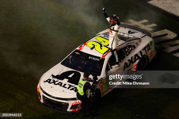 William Byron, driver of the Axalta Chevrolet, celebrates after winning the NASCAR Cup Series Daytona 500 at Daytona International Speedway on...