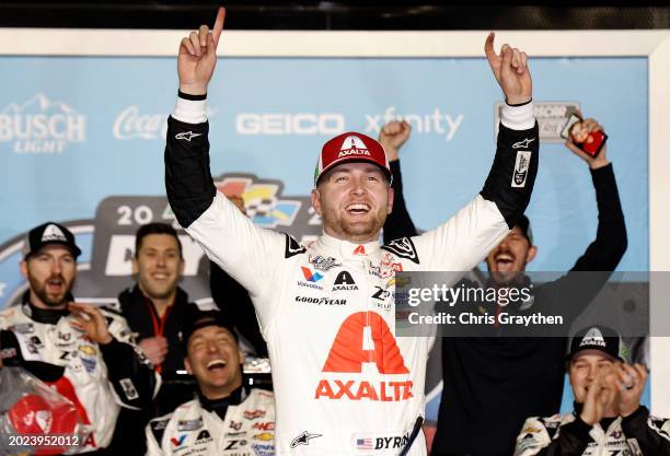 William Byron, driver of the Axalta Chevrolet, celebrates in victory lane after winning the NASCAR Cup Series Daytona 500 at Daytona International...