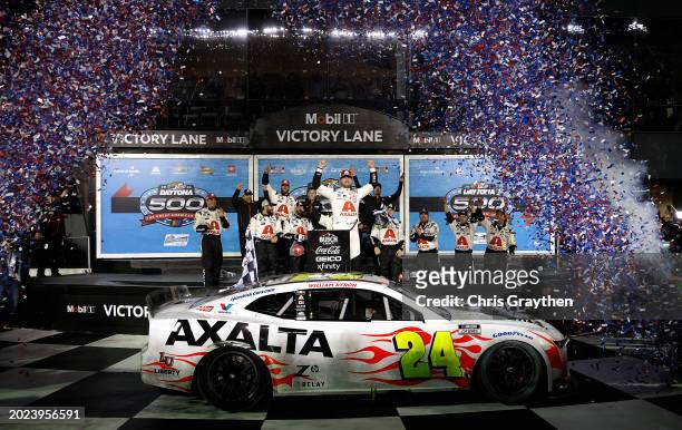 William Byron, driver of the Axalta Chevrolet, celebrates in victory lane after winning the NASCAR Cup Series Daytona 500 at Daytona International...